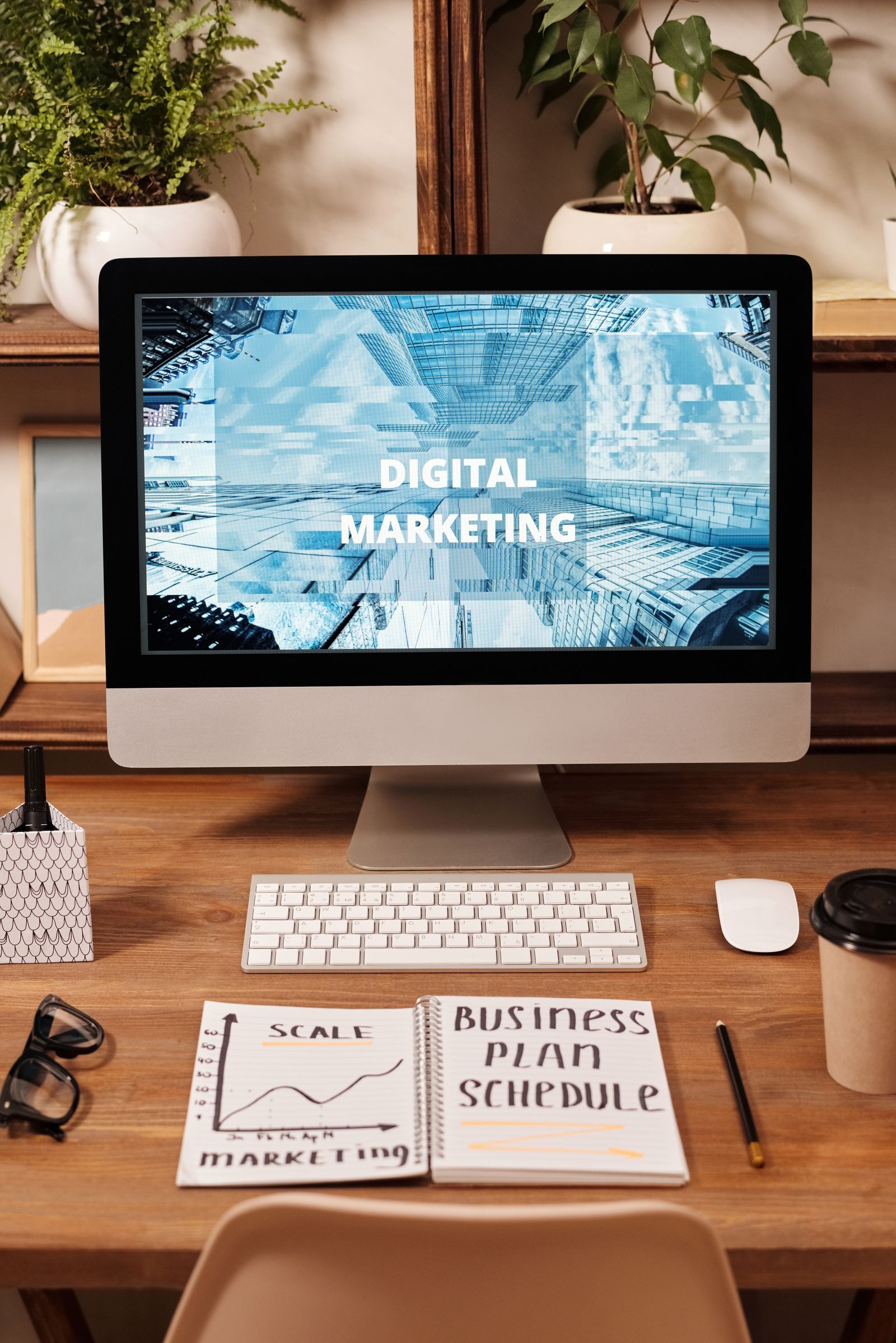 Digital marketing strategy workspace with computer screen displaying strategy content